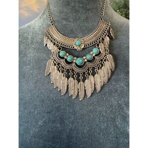 Nadine west silver-toned bib  layered fringe and turquoise stone accents.